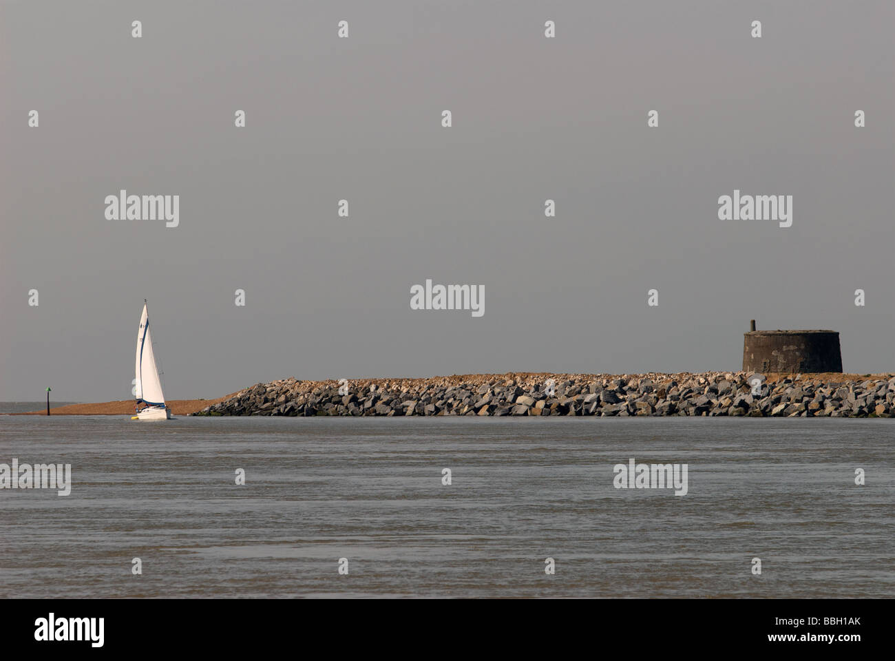 Rock armor protecting the beach from coastal erosion at the mouth of the river Deben, Felixstowe Ferry, Suffolk, UK. Stock Photo