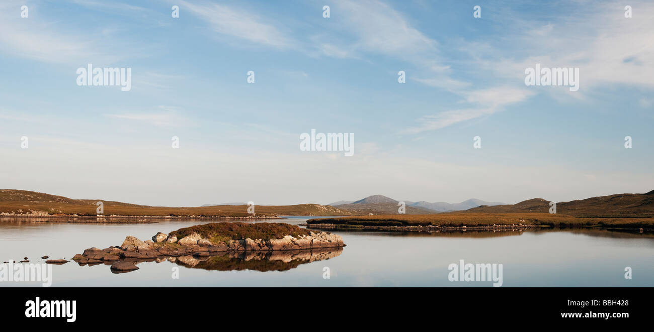 Evening light on a loch, Isle of Lewis, Outer Hebrides, Scotland. Panoramic Stock Photo