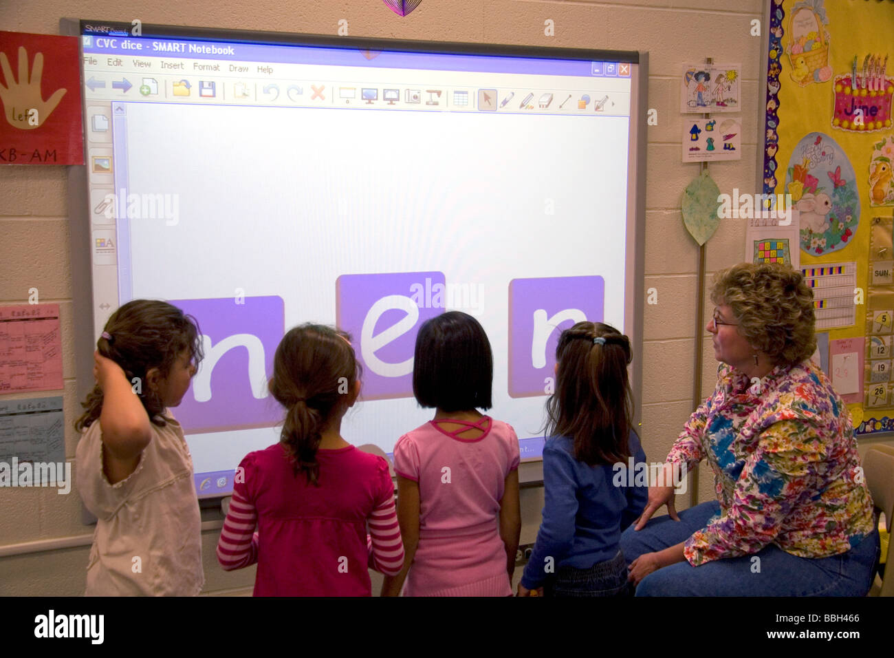 Kindergarten students use an interactive whiteboard in the classroom of a public school in Boise Idaho USA MR Stock Photo