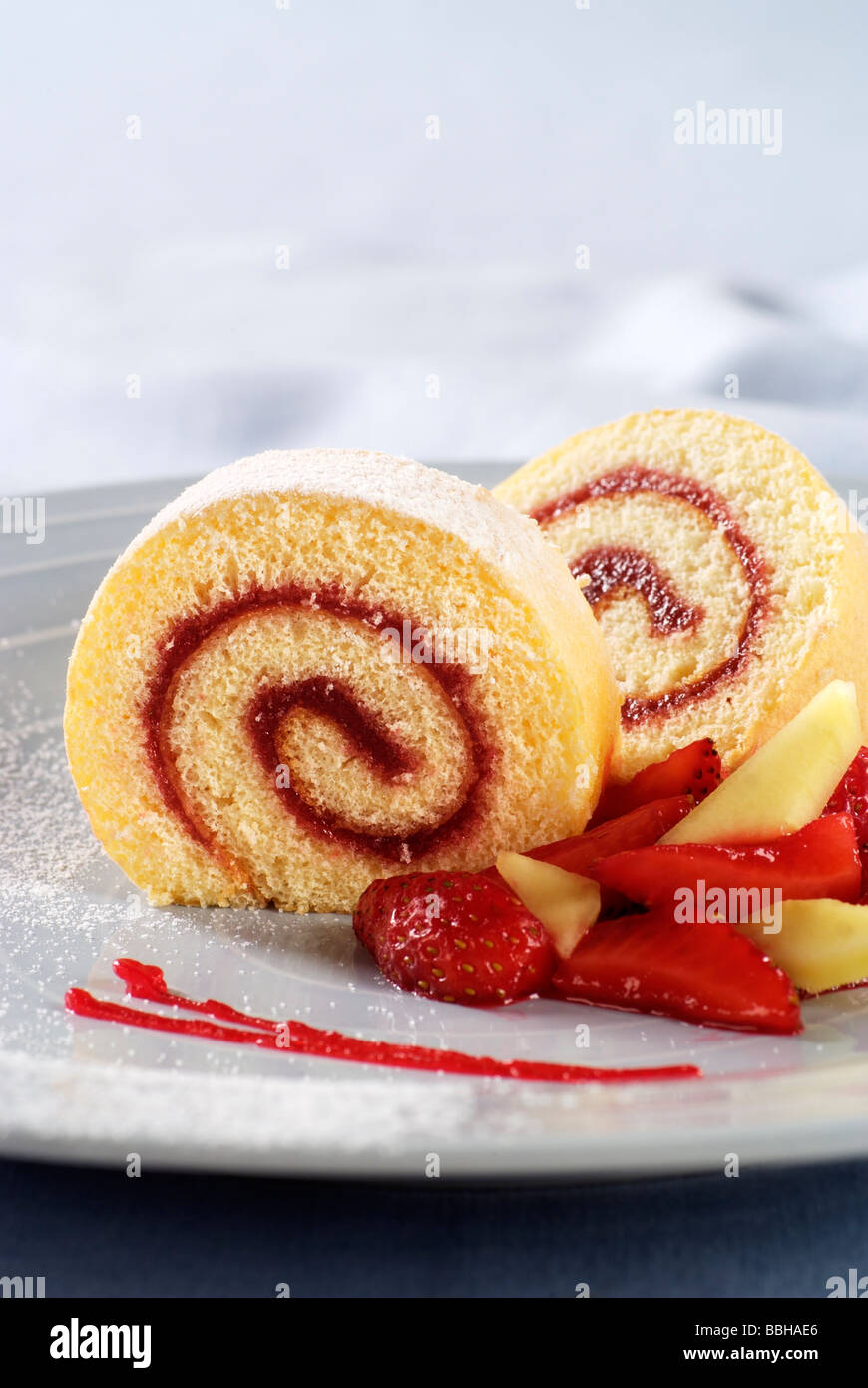 Strawberry jam Swiss roll Stock Photo - Alamy