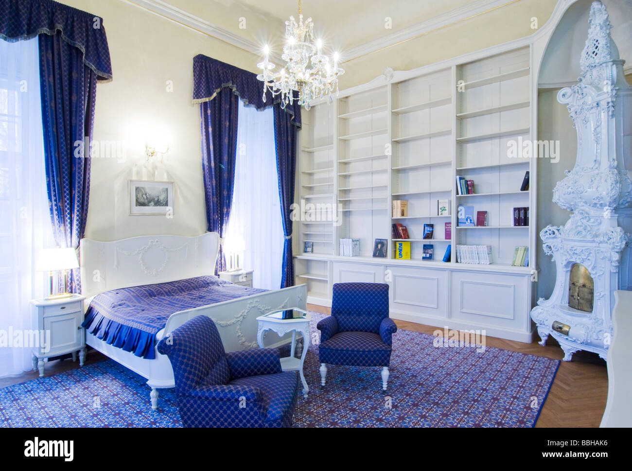 Luxury hotel room with antique furniture and ceramic stove Stock Photo