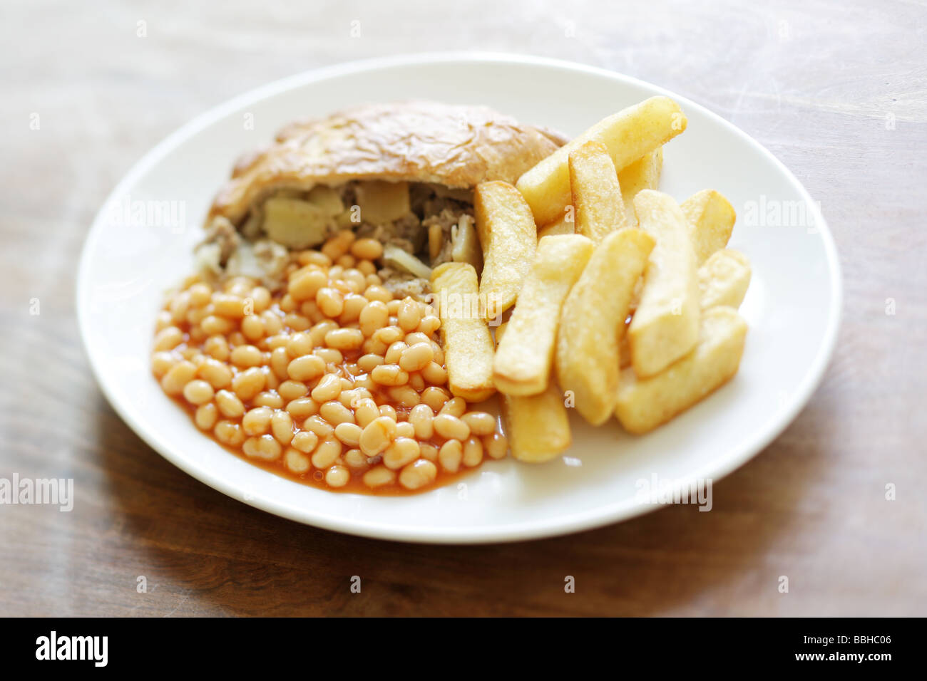 Traditional British Cornish Pasty with Chips and Baked Beans In Tomato