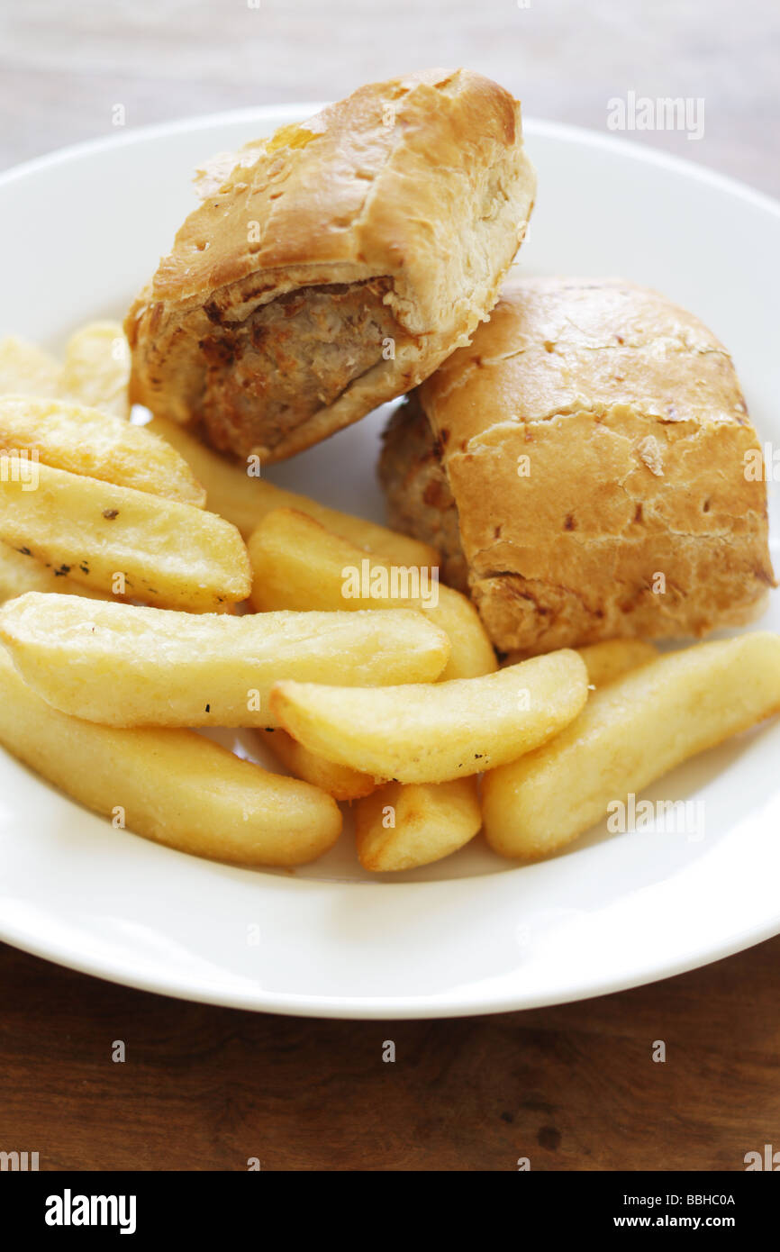 Authentic British Style Sausage Roll with Chips Served On A Plate With No People Stock Photo