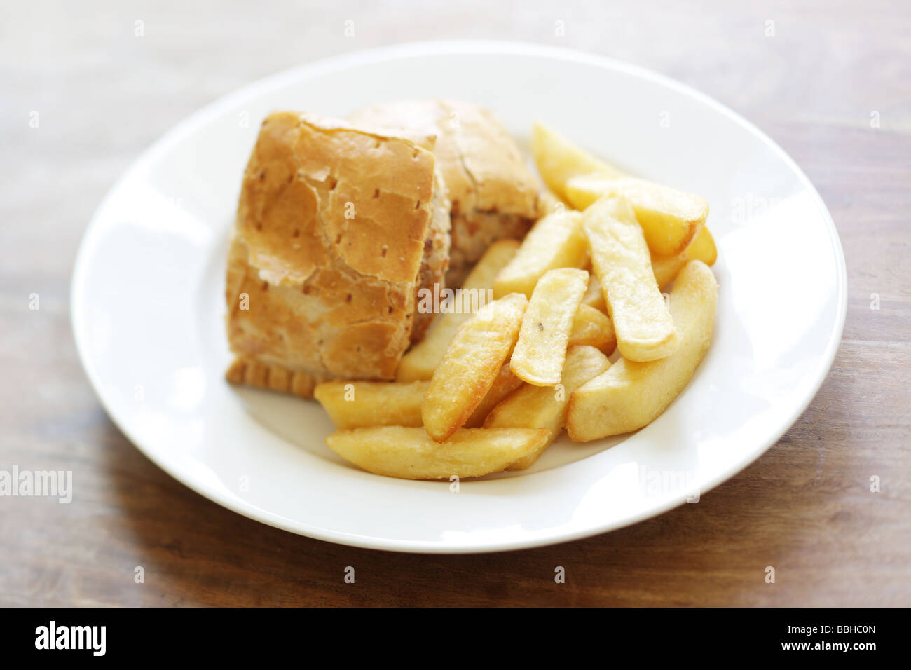 Authentic British Style Sausage Roll With Chips Served On A Plate With No People Stock Photo Alamy