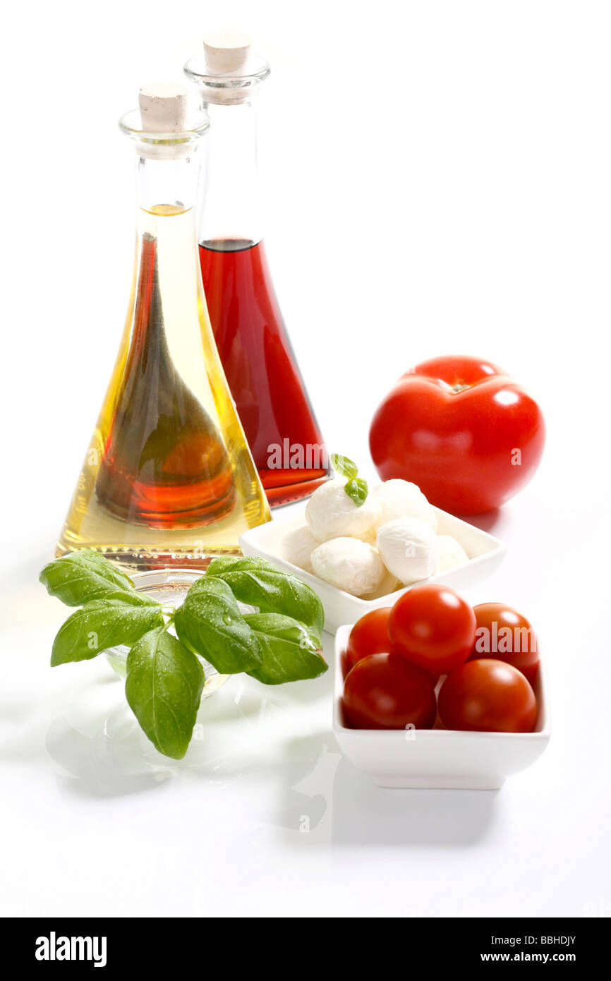 Tomatoes, mozzarella, basil, olive oil and balsamic vinegar Stock Photo