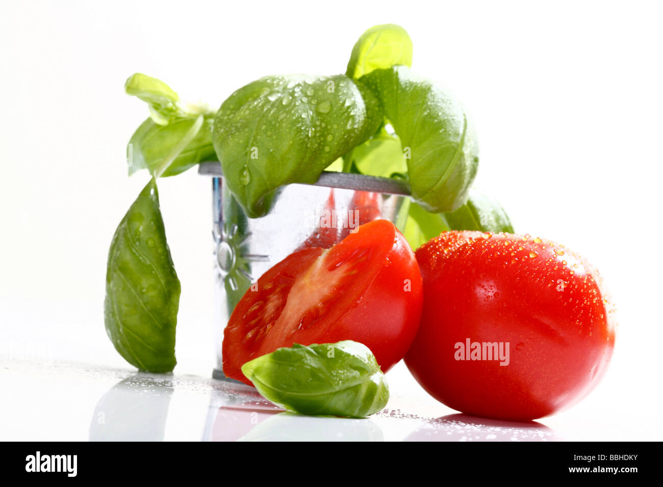 Tomatoes and basil Stock Photo