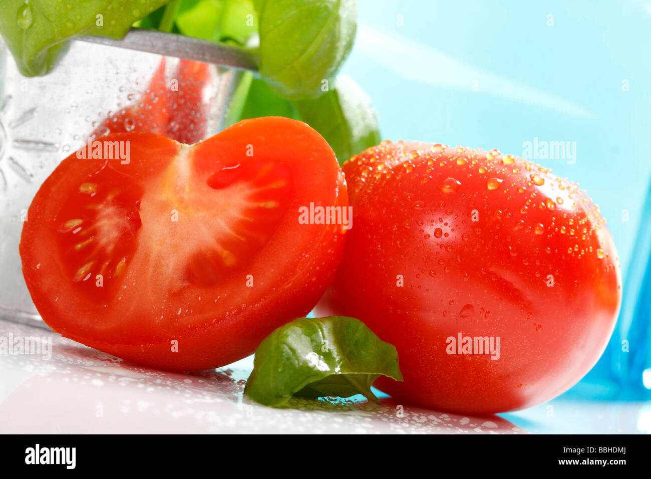 Tomatoes and basil Stock Photo