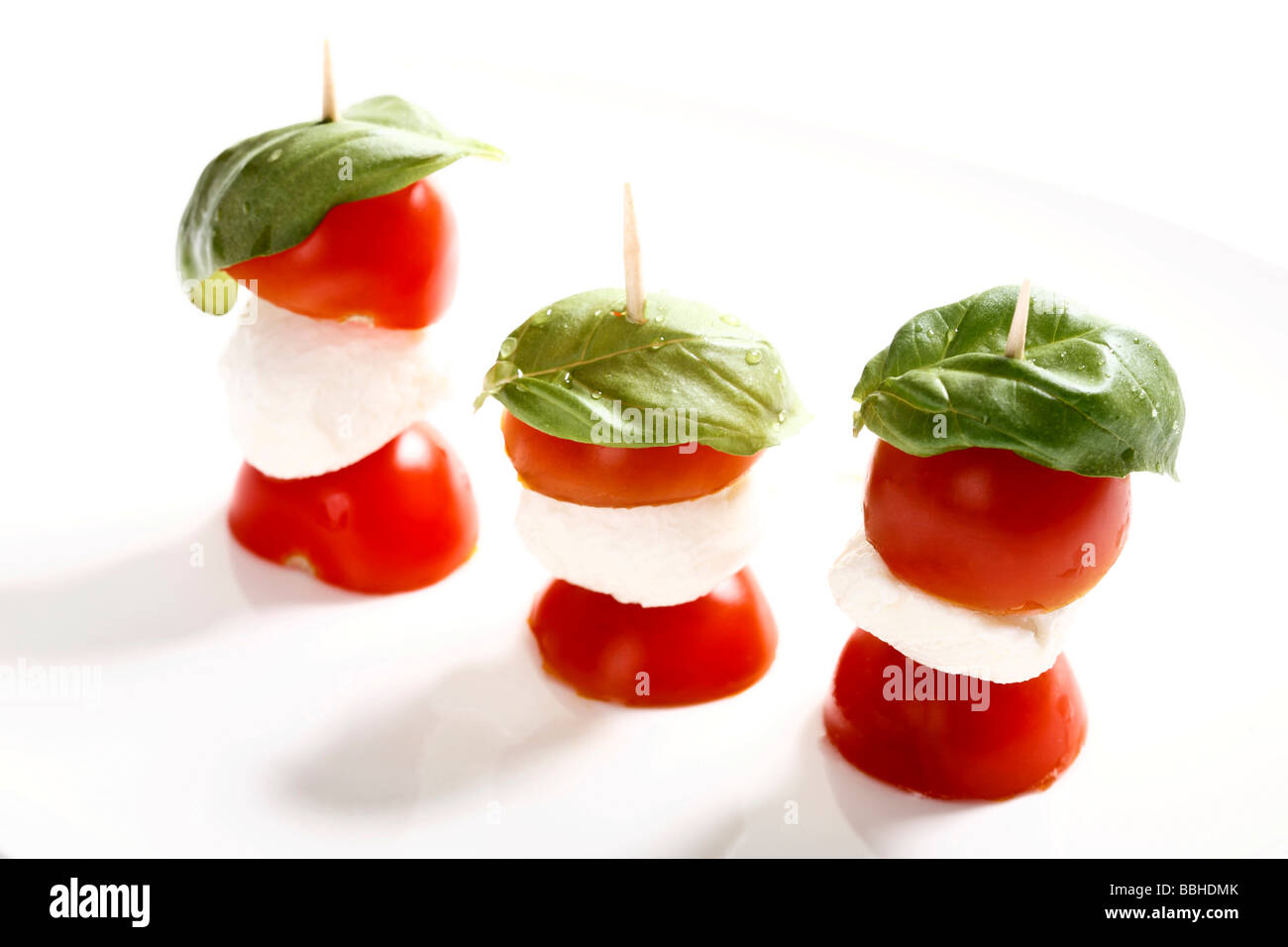 Tomato-mozzarella sticks with basil Stock Photo