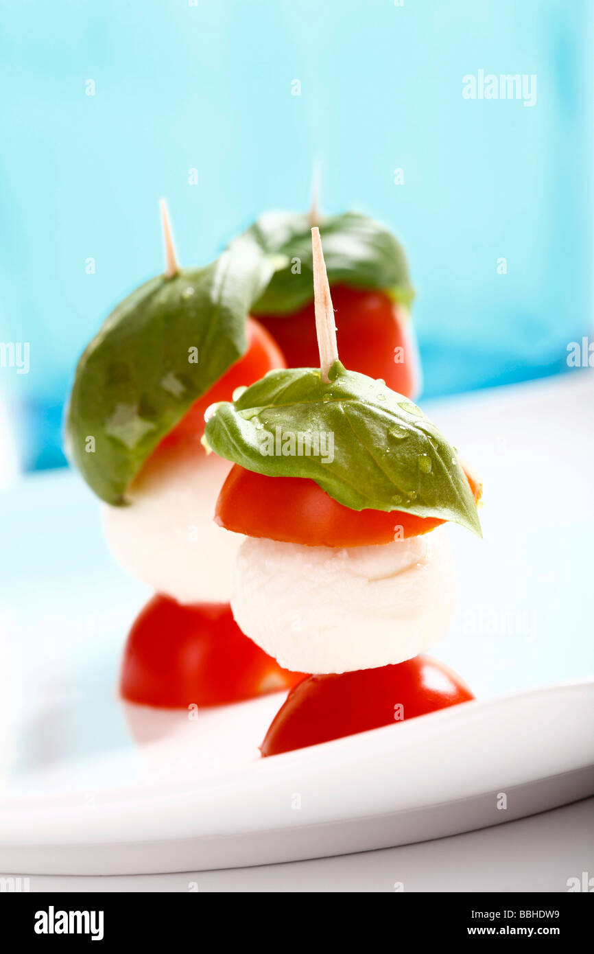 Tomato-mozzarella sticks with basil Stock Photo