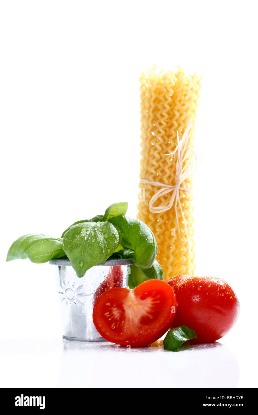 Tomatoes, basil and noodles Stock Photo