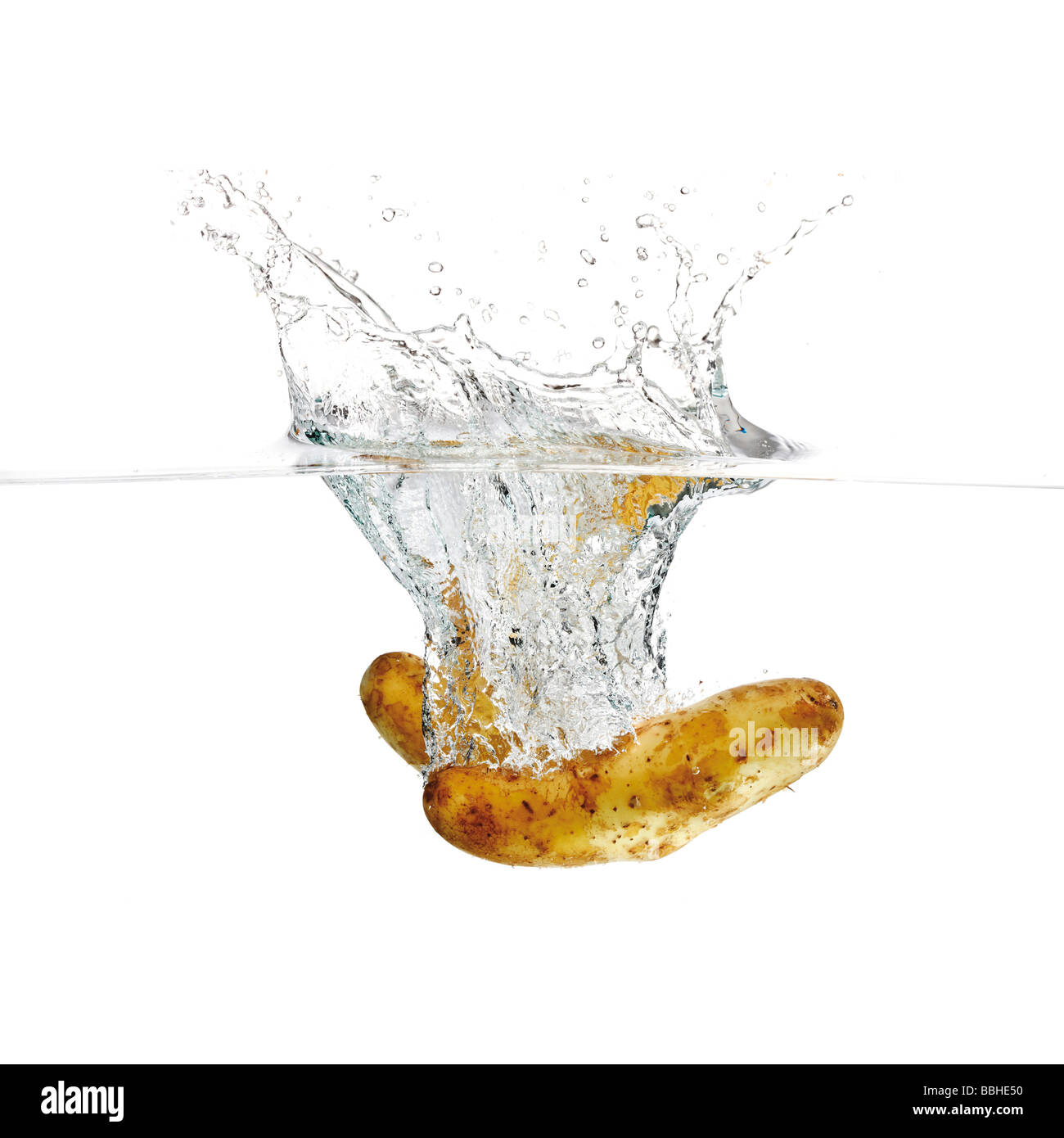Potatoes in water Stock Photo Alamy