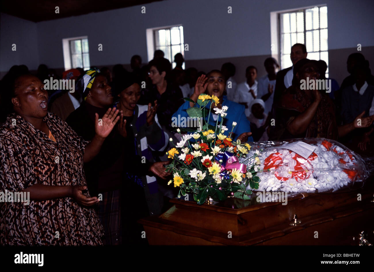 Women sing around the coffin of Rose Mabikwe Mama Rose Mabikwe was the wife of Tata Dominic Mabikwe Prior to her death the Stock Photo