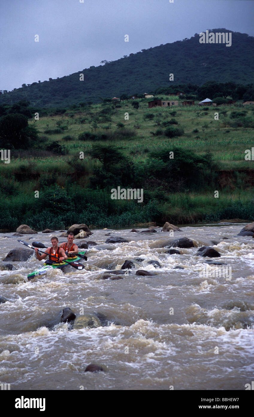 Warren Price and Scott Maynard shoot a rapid on the Umsundusi river during the Husquarvana Non Stop Dusi Now called the Stihl Stock Photo