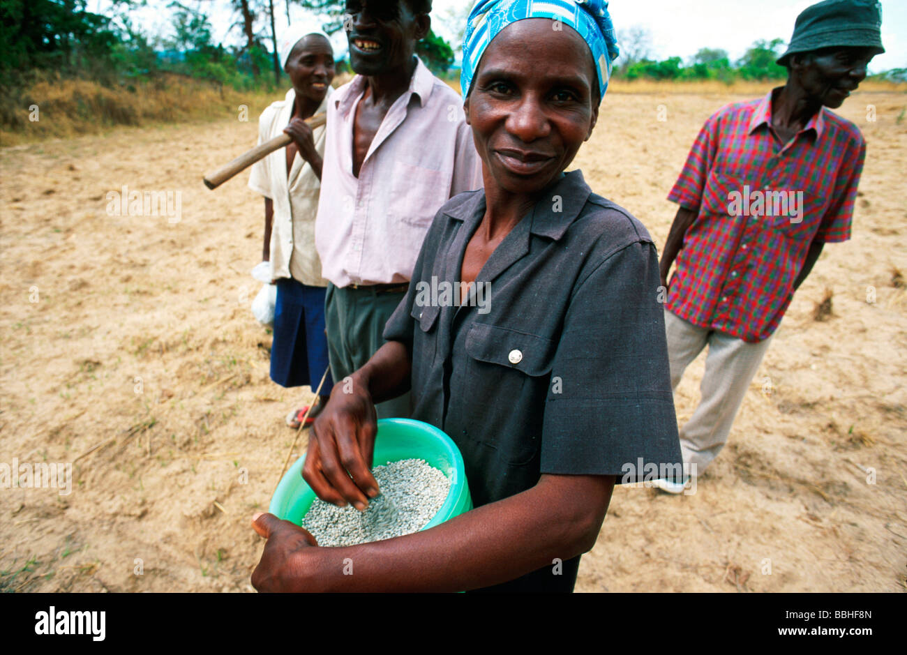 Jessie Kuripa Holds A Container Of Fertilizer Together With Other Stock Photo Alamy