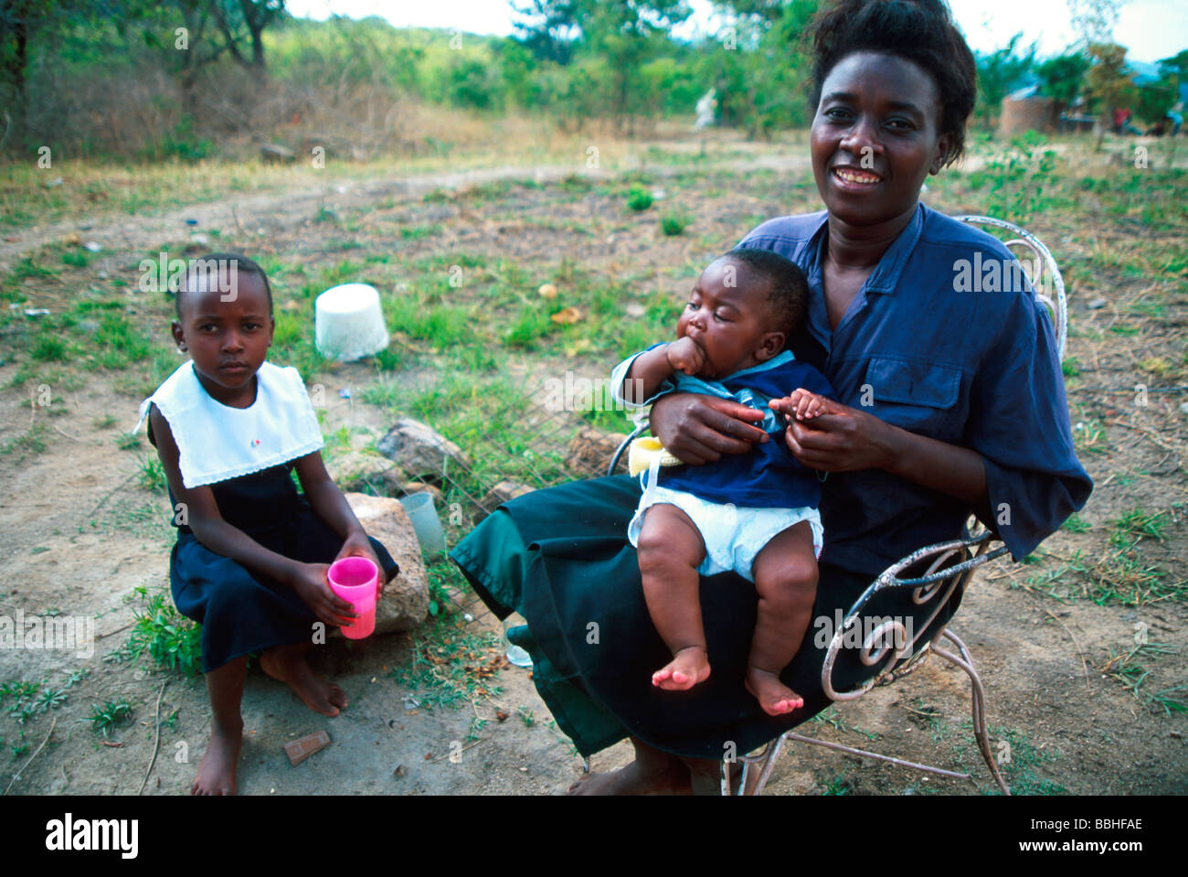 In spite of the hardships of caring for a rural community where there is little food Mary Chariekera manages a smile as she Stock Photo