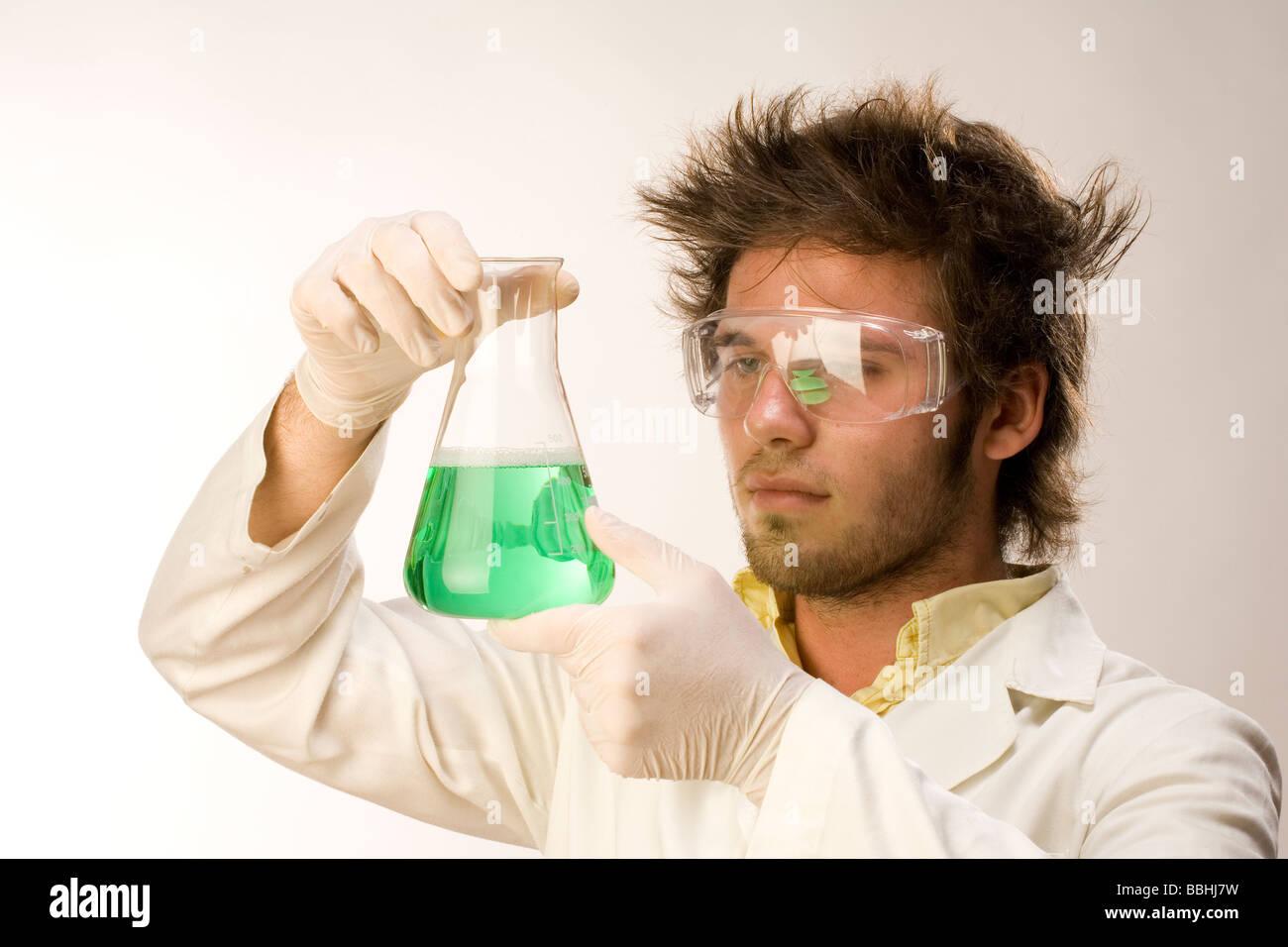 chemist biologist scientist man boy with test tube retrato de hombre científico con probeta Stock Photo