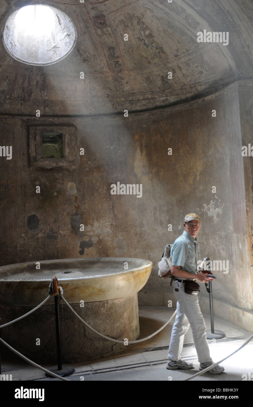 A tourist at the forum baths in Pompeii Stock Photo