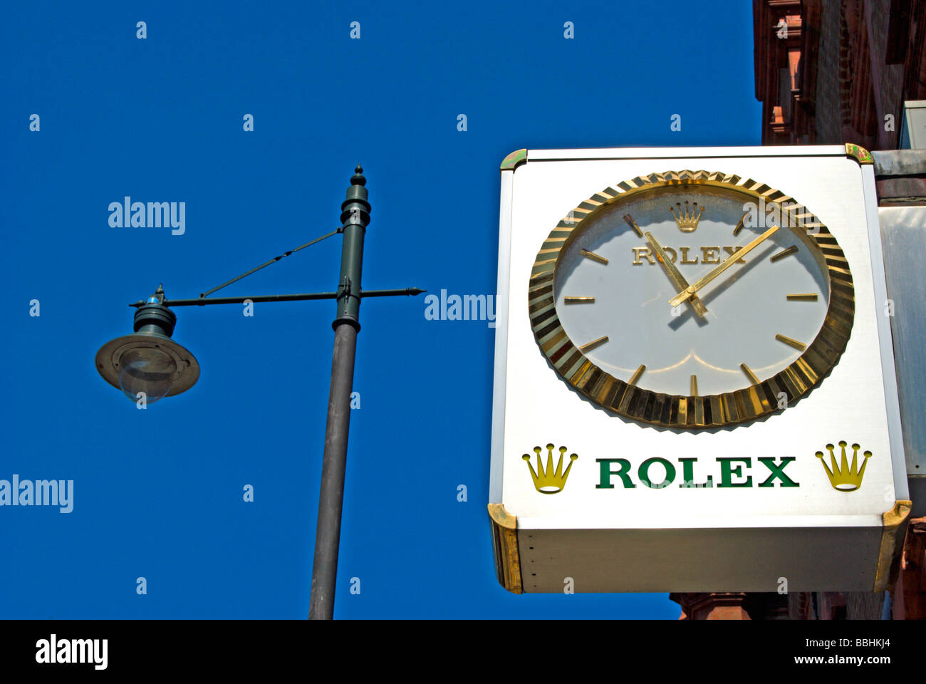 clock and rolex logo outside halfhide, a specialist clock and watch dealer in wimbledon, southwest london, england Stock Photo