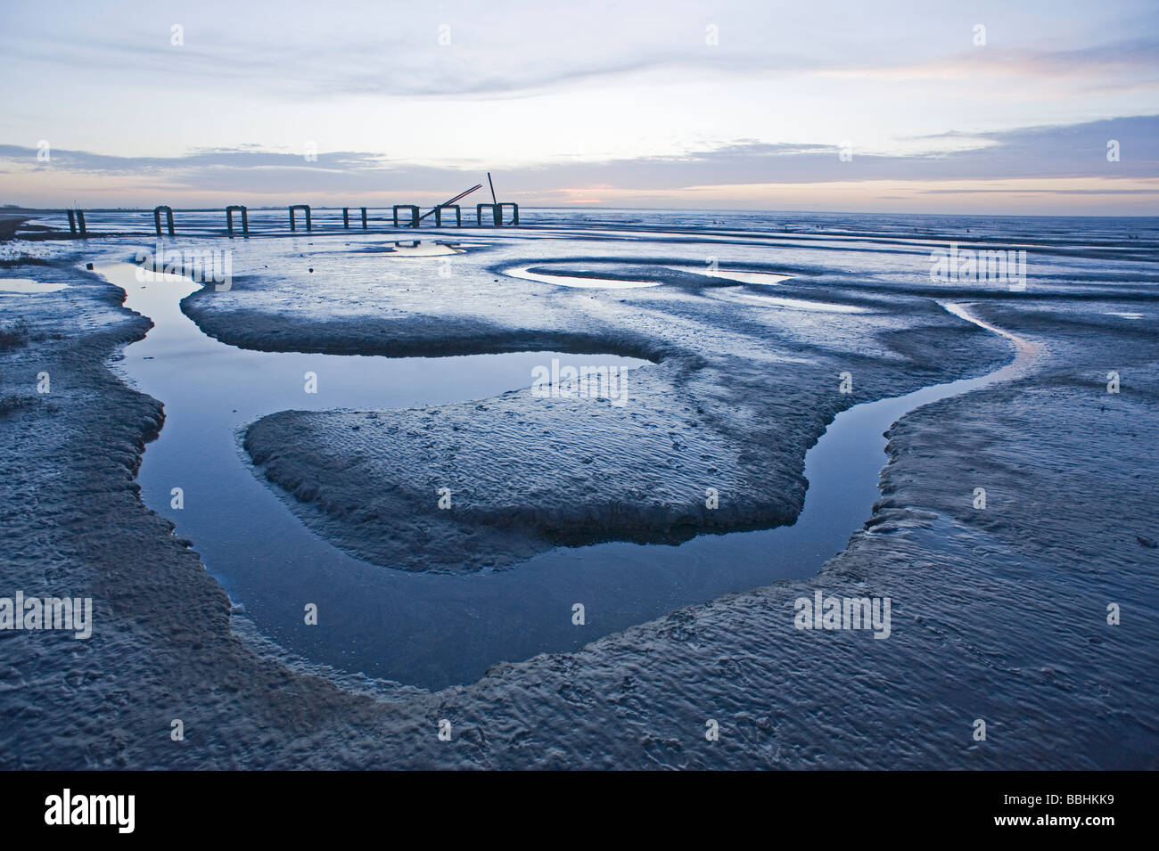 The Wash viewed from Snettisham RSPB Reserve Norfolk at dusk and at low tide in winter Stock Photo