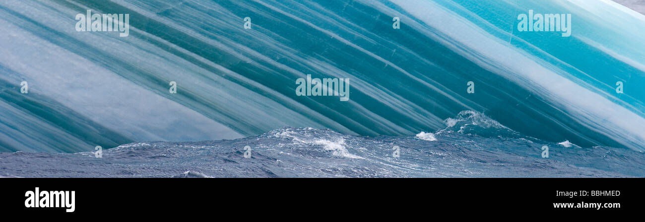 Close up of side of iceberg showing layers of compacted blue ice Southern Ocean off Antarctica October Stock Photo