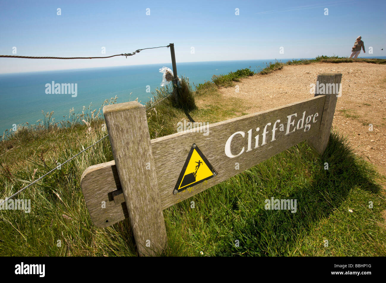Warning signs on the clifftop at Beachy Head a notorious suicide spot in the UK Stock Photo