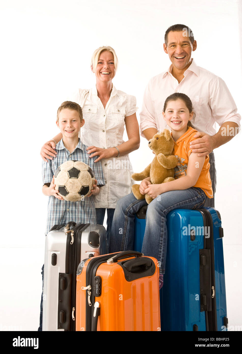 Family with packed suitcases Stock Photo Alamy