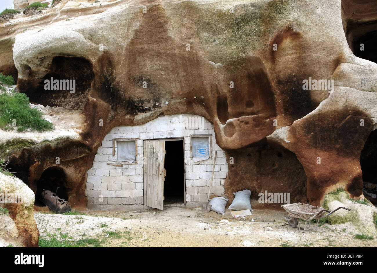 Troglodyte caravan inside rock dwelling Stock Photo
