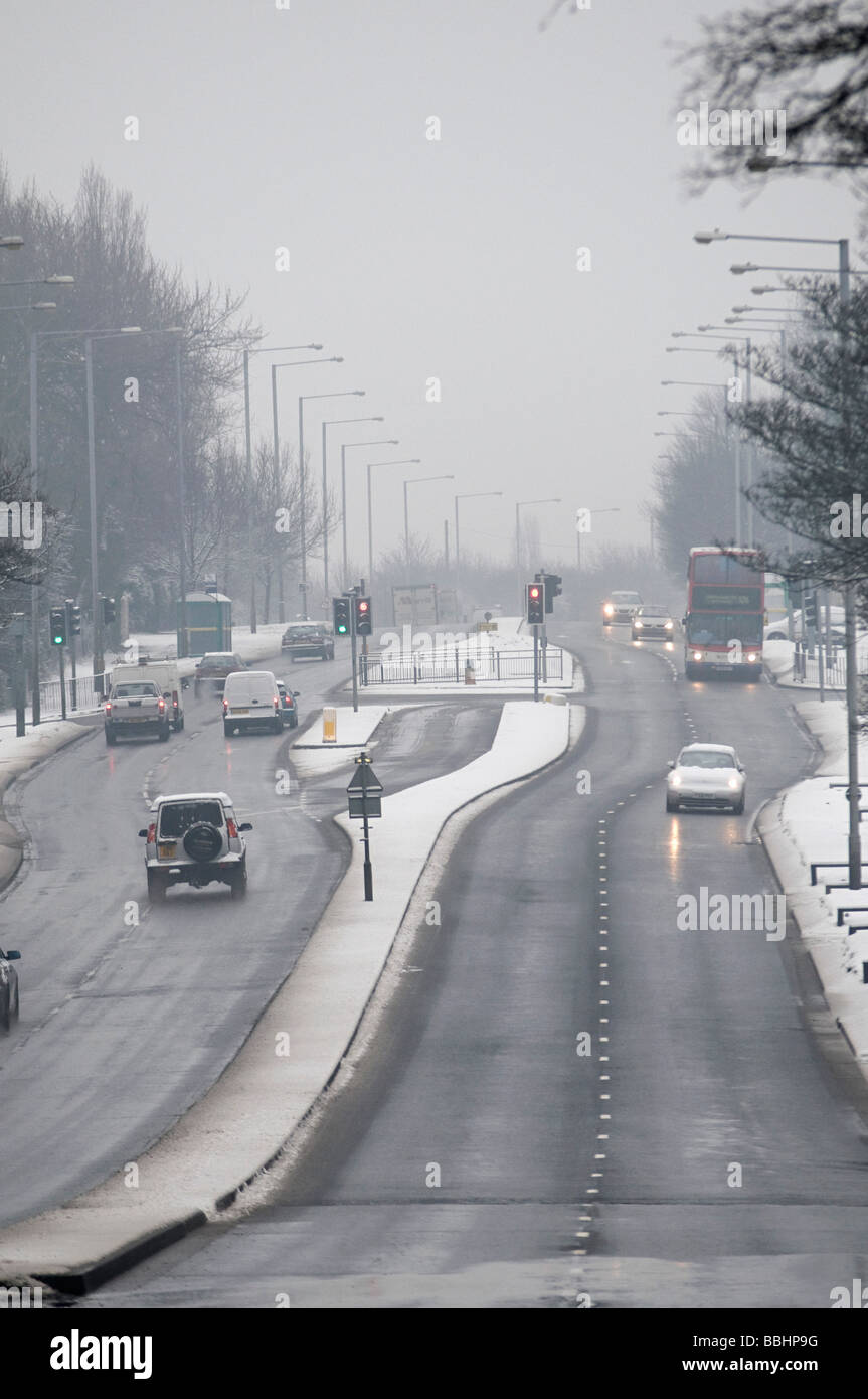 Wolverhampton new road in dudley during the snow with cars and bus's