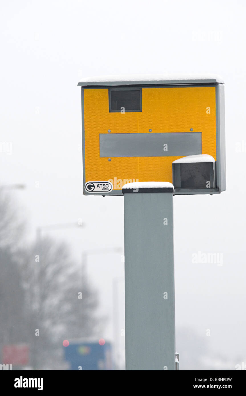 a speed camera or gatso on a main road with snow on it Stock Photo - Alamy
