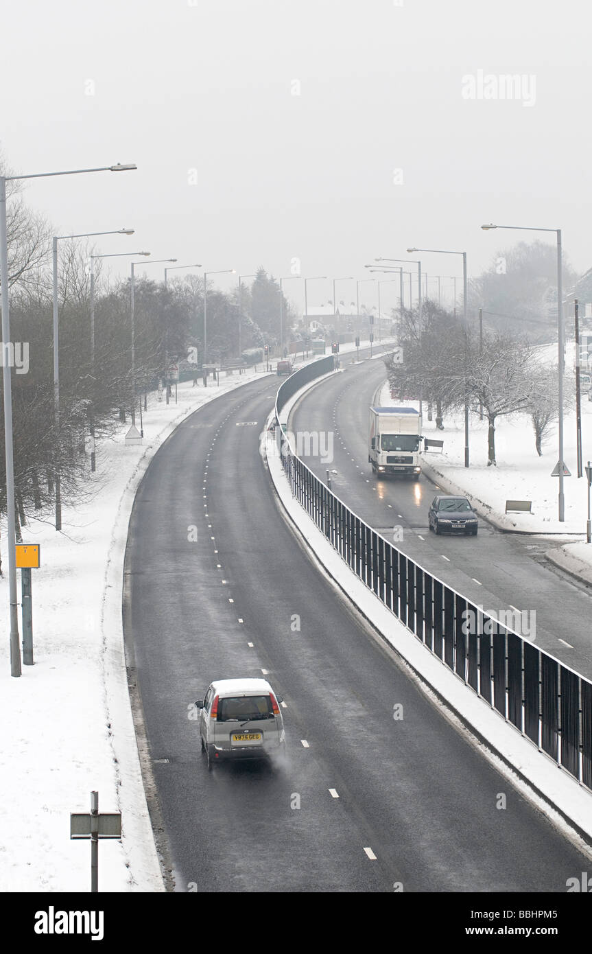 Wolverhampton new road in dudley during the snow with cars and bus's