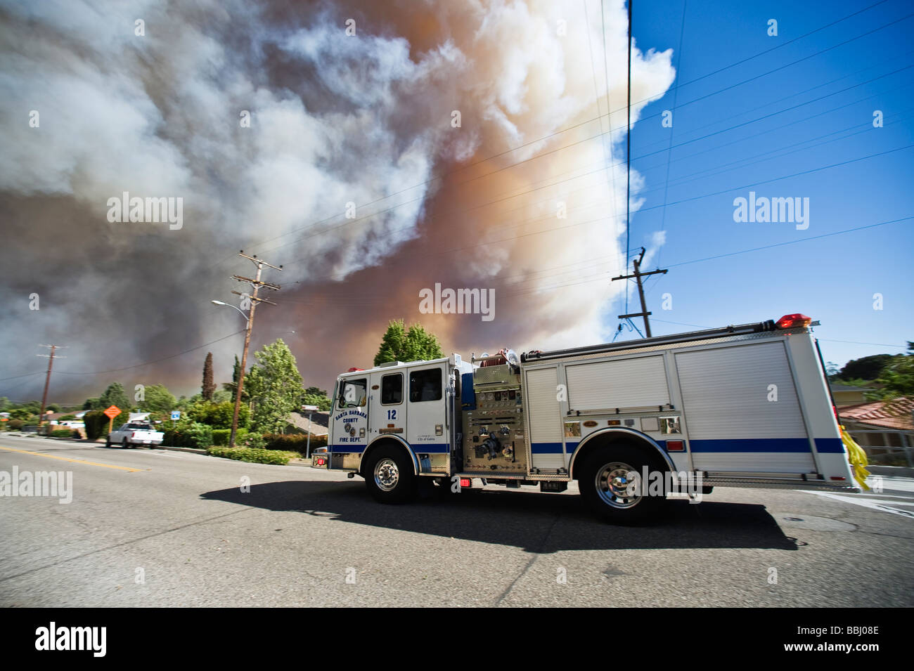 Santa Barbara, California - Fire engine drives along Foothill rd with smoke filled sky during jesusita fire, Wed, May 6 2009 Stock Photo