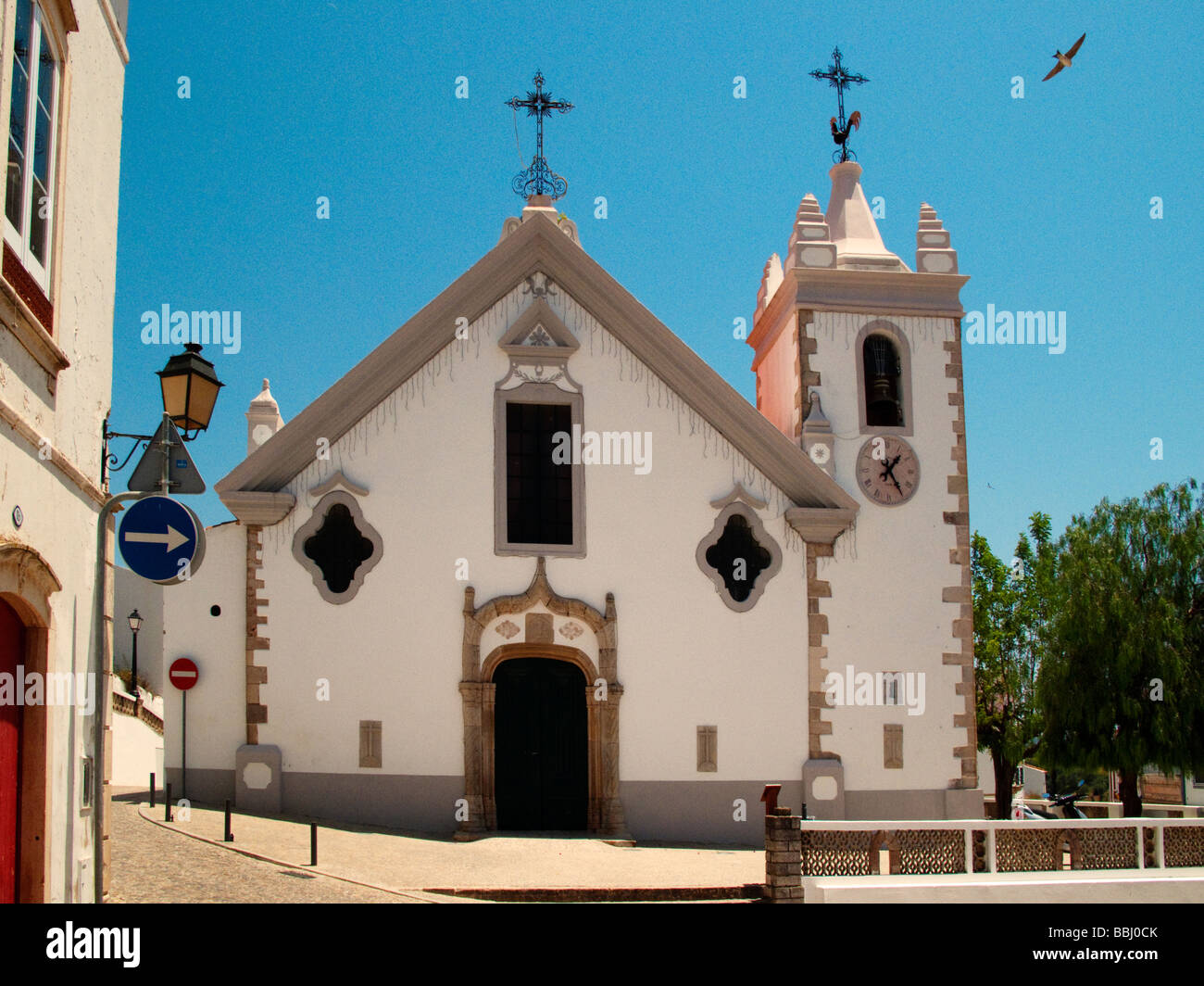 The Church OUR MOTHER OF ASSUMPTION known for its Manueline doorway and baroque eye windows Alte Portugal Stock Photo
