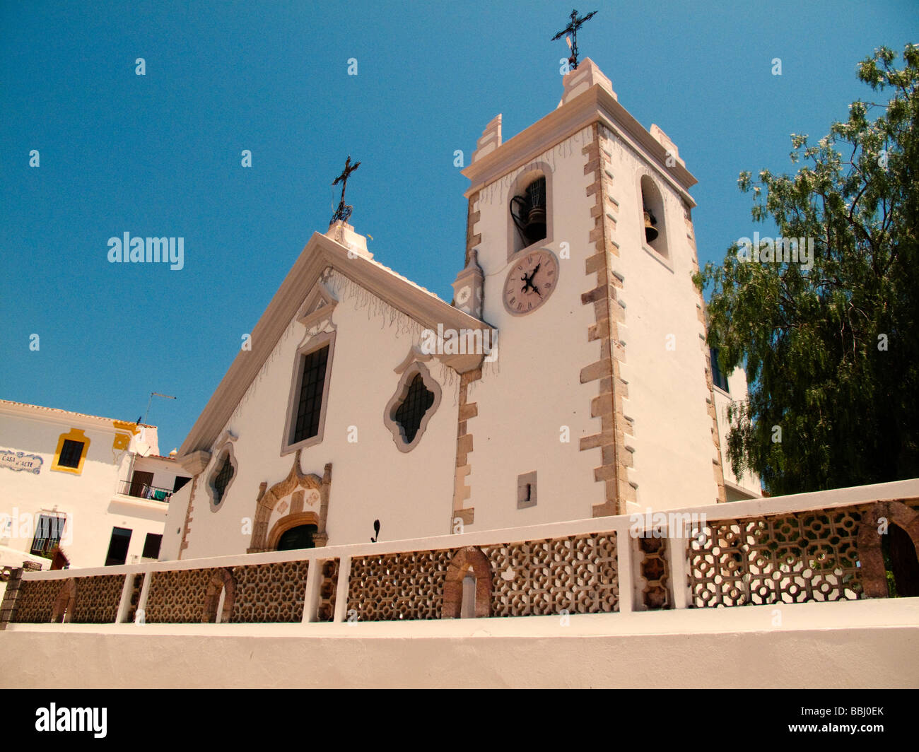 The Church OUR MOTHER OF ASSUMPTION known for its Manueline doorway and baroque eye windows Alte Portugal Stock Photo