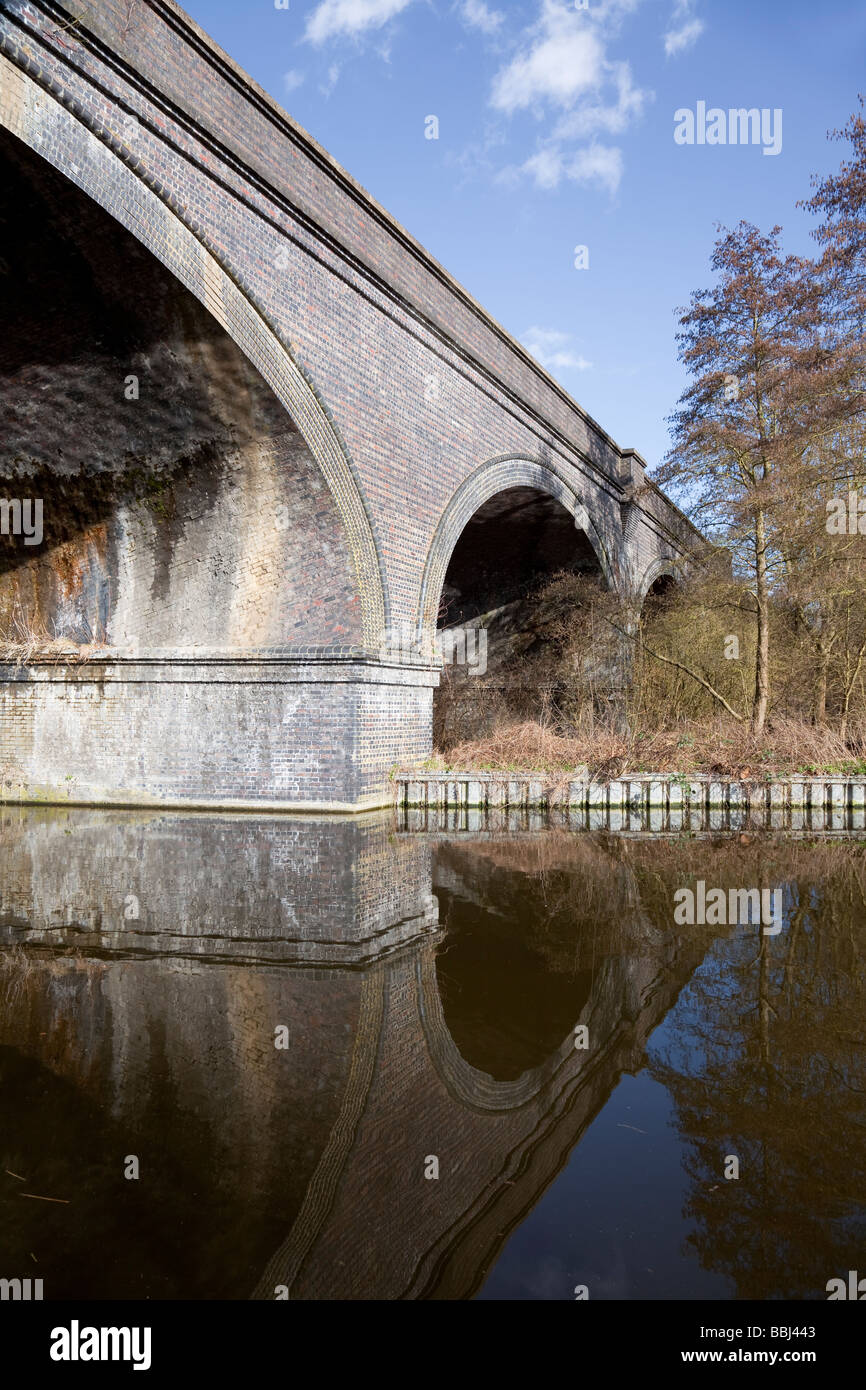 Grand Union Canal with arched railway bridge, Denham Country Park, Buckinghamshire, England, UK Stock Photo