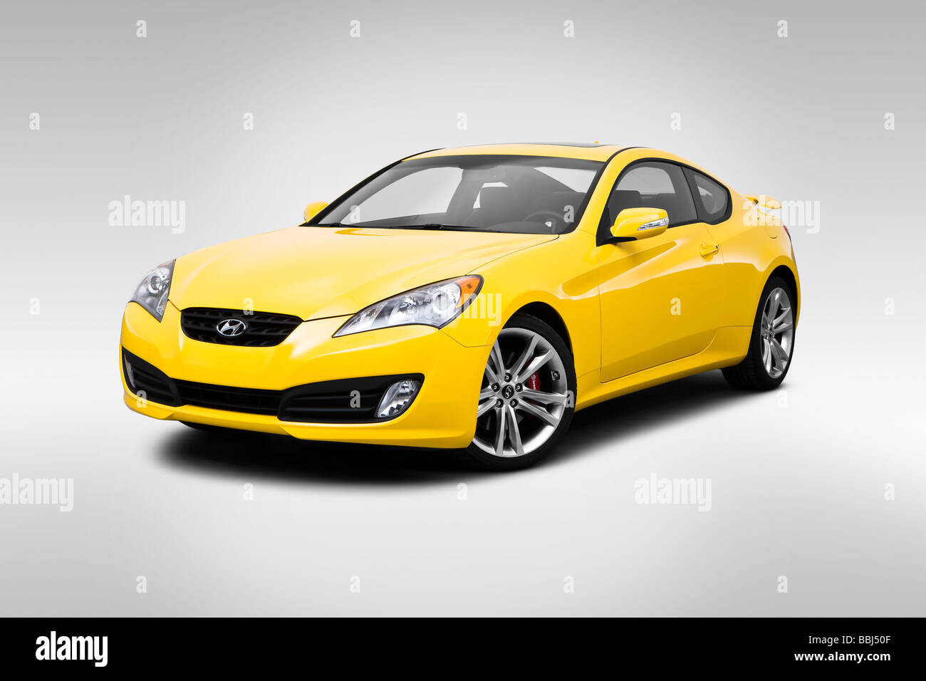 2010 Hyundai Genesis 3.8 Track in Yellow - Front angle view Stock Photo