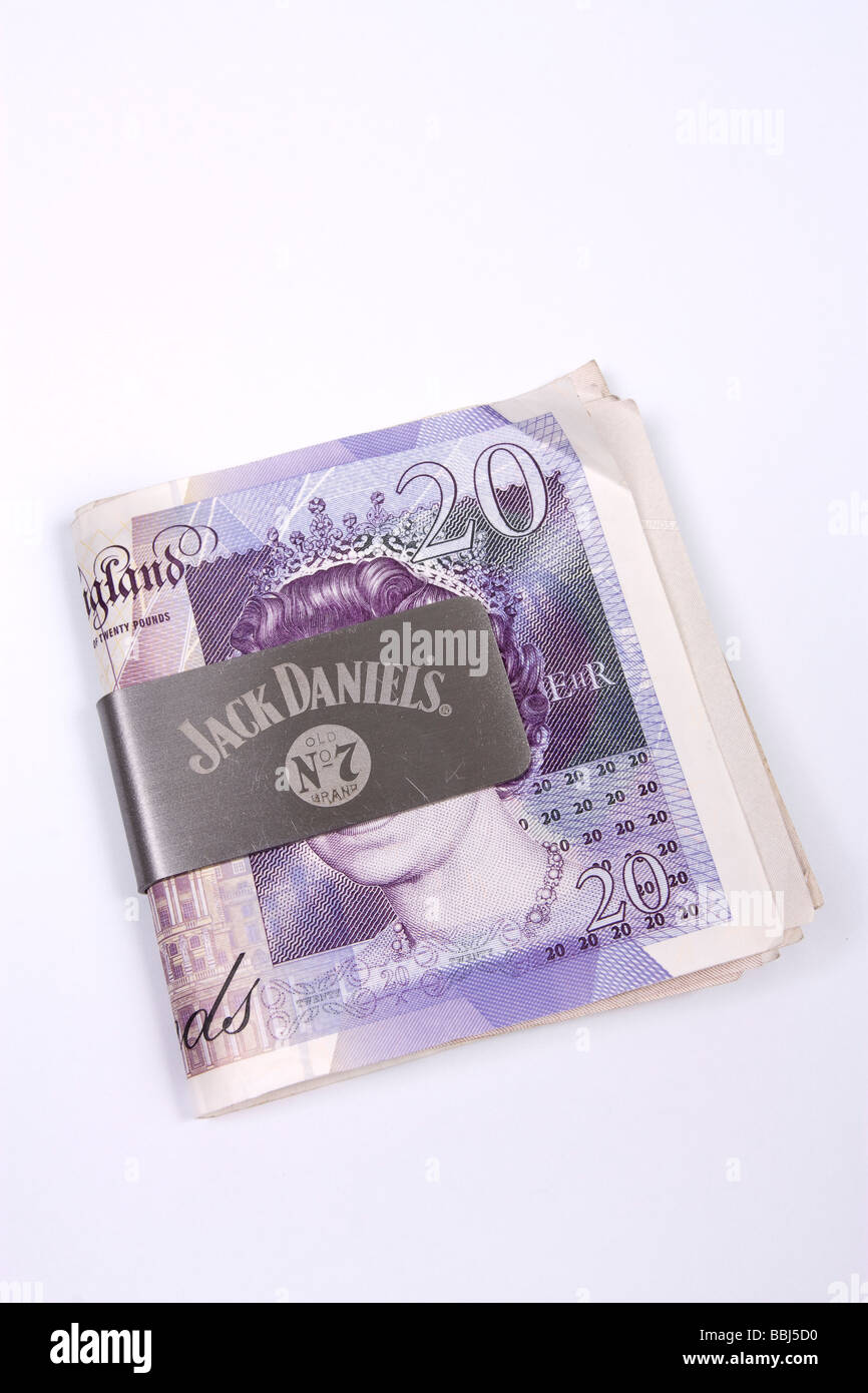 Jack Daniels money clip with english twenty pound notes Stock Photo - Alamy