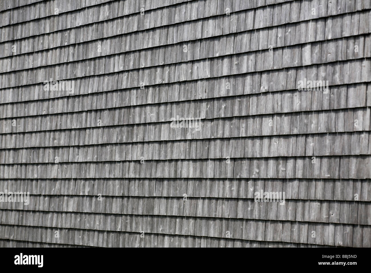 Wooden shingles covering a wall (Puy-de-Dôme - France). Bardeaux de bois recouvrant un mur (Puy-de-Dôme - France). Stock Photo