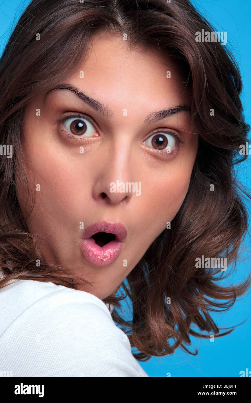 Portrait of an attractive young woman with a shocked expression of her face Stock Photo
