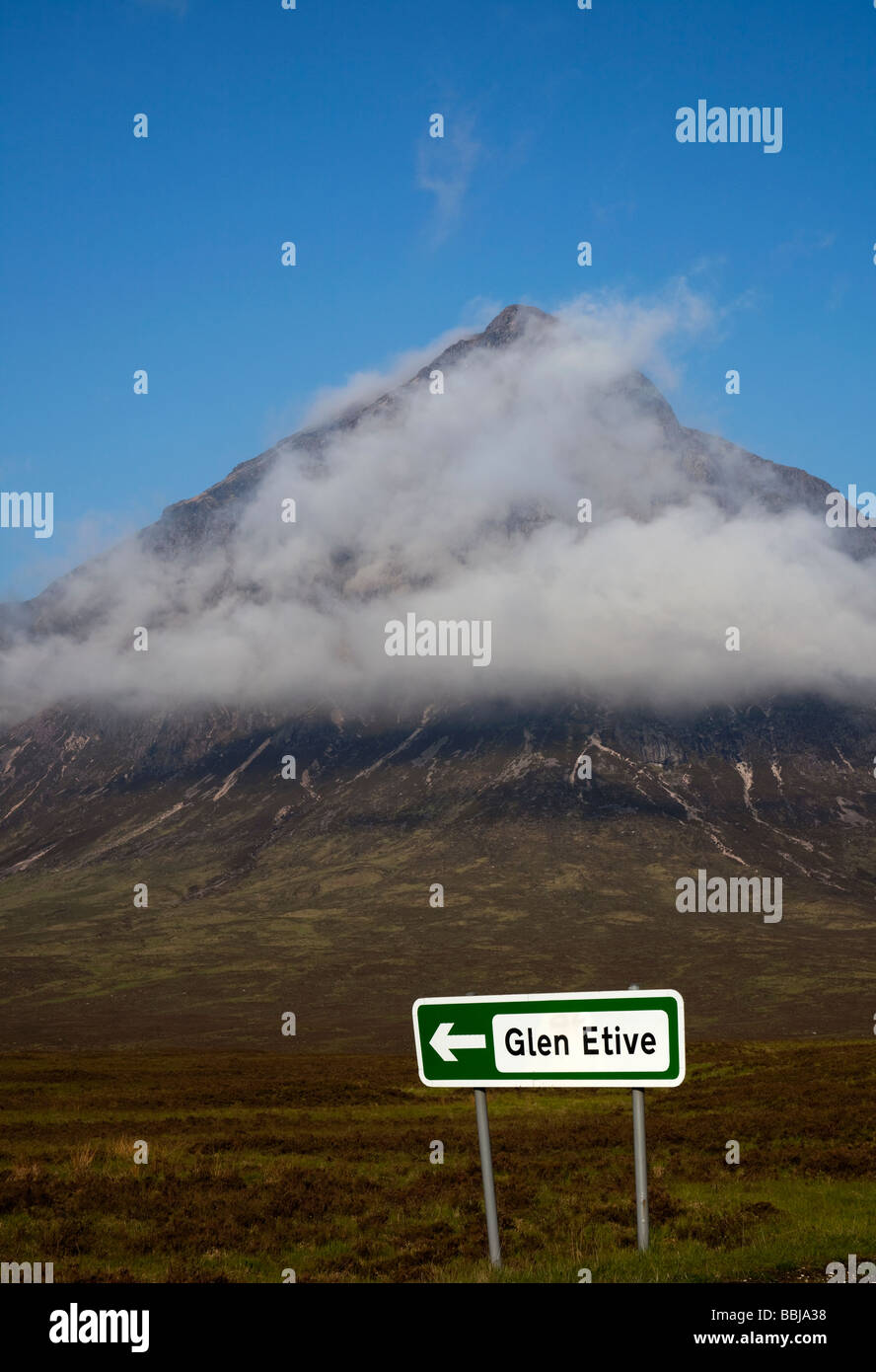 Buachaille Etive Mor mountain shrouded in mist with Glen Etive signpost in foreground, Scotland, UK, Europe Stock Photo