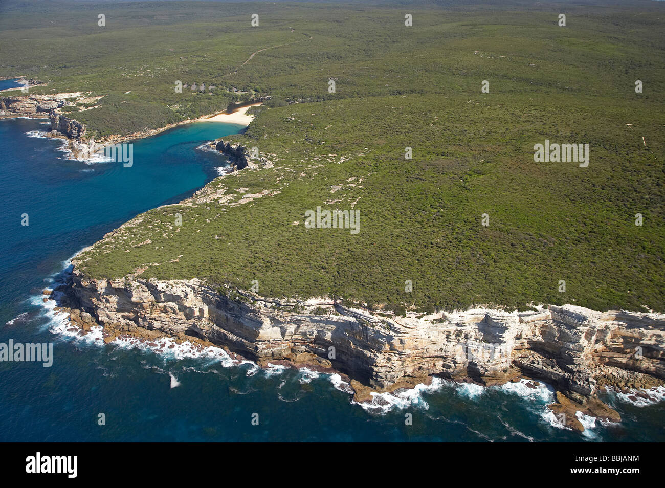 Cliffs and Wattamolla Beach Royal National Park south of Sydney New South Wales Australia aerial Stock Photo