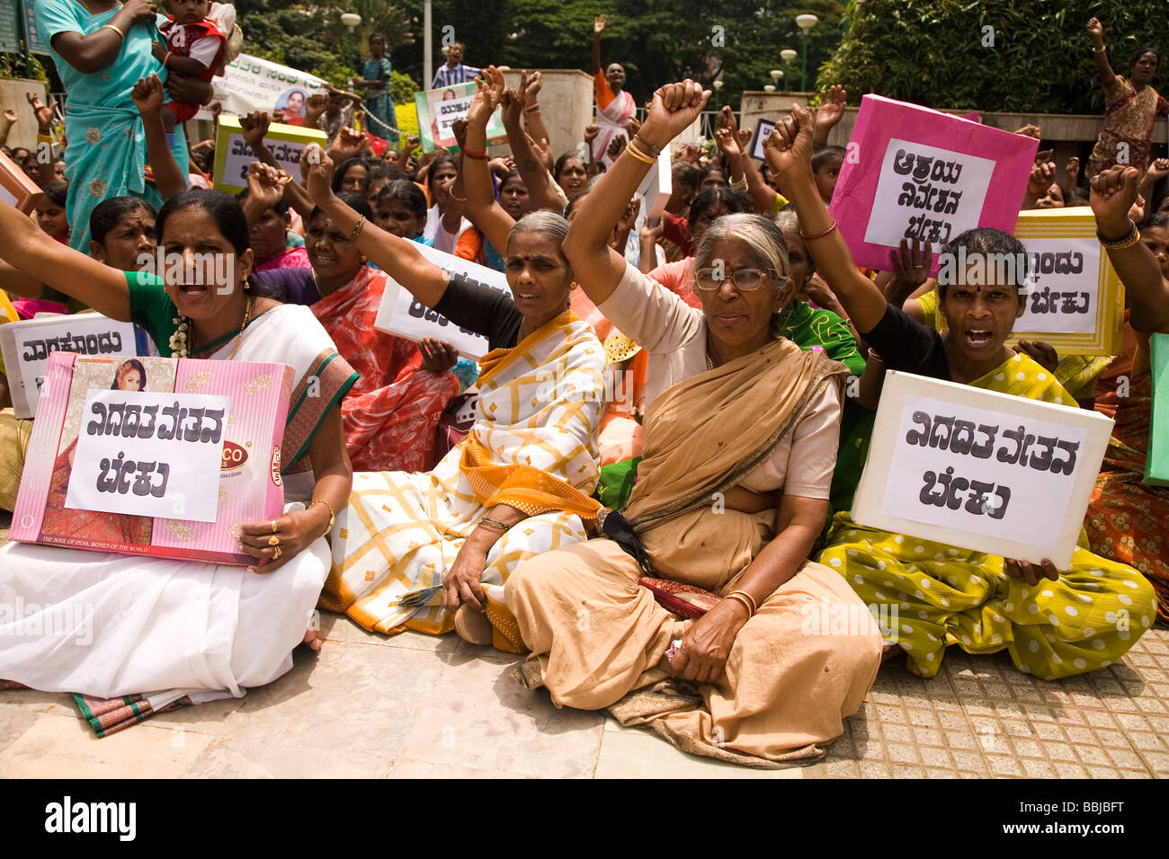 Women hold placards during a protest in Bangalore, India. The women are demostrating for women's and dalit (untouchable) rights. Stock Photo