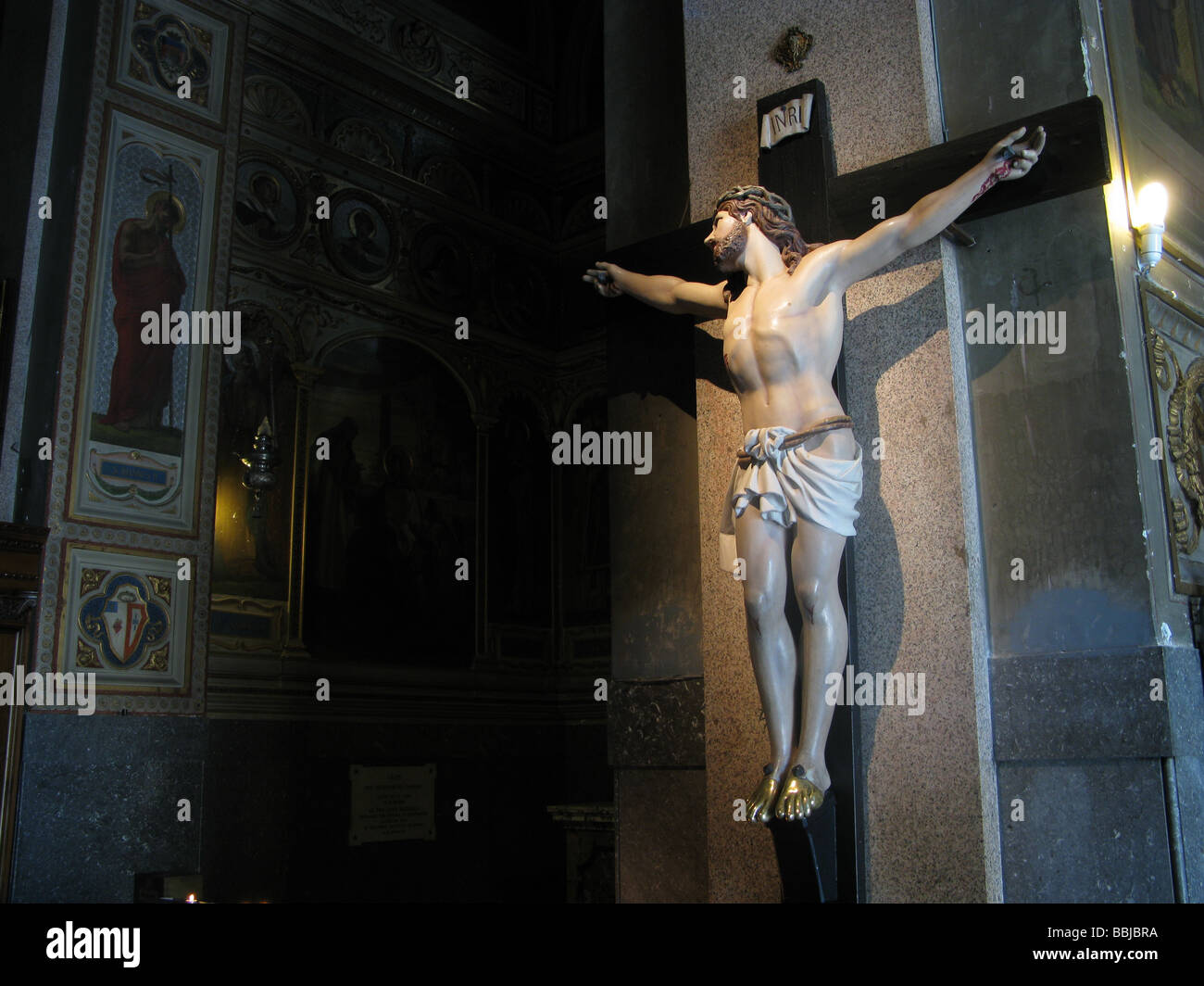 jesus on cross statue in church in rome italy Stock Photo - Alamy