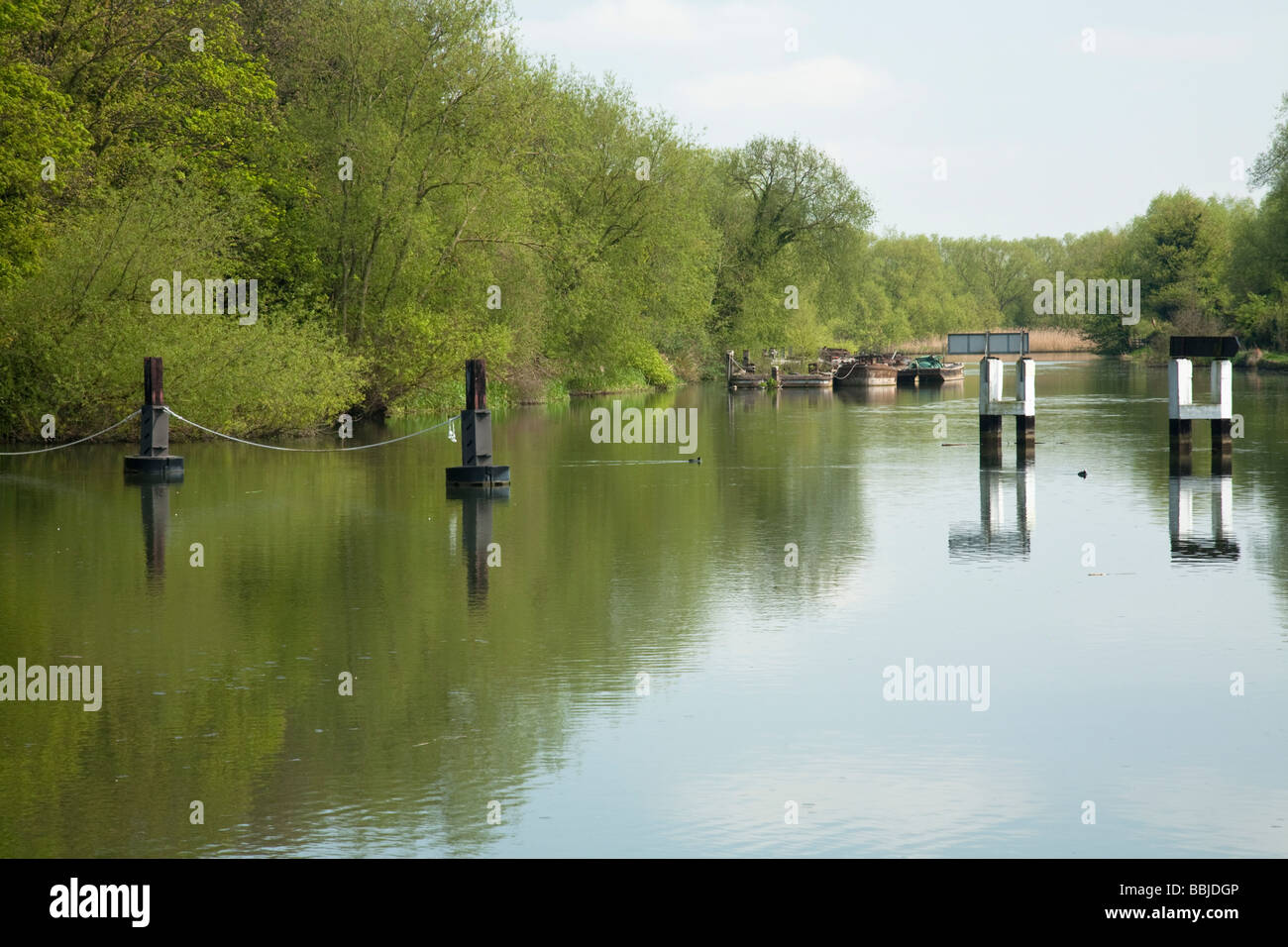 Dredging barges moored above the weir and lock at Abingdon Oxfordshire Uk Stock Photo