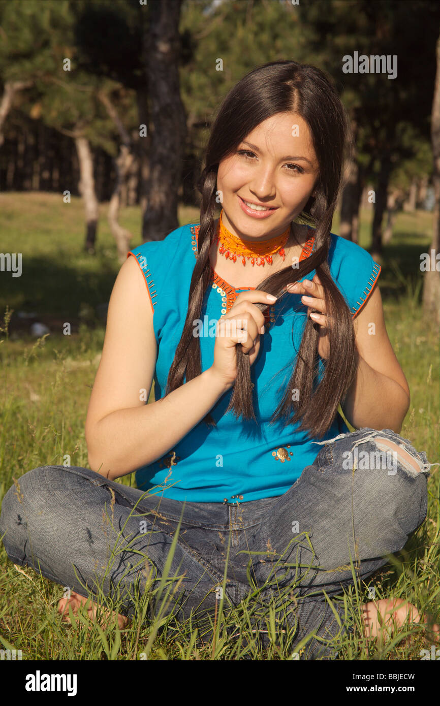 Portrait of the beautiful girl on a background of green trees Stock ...