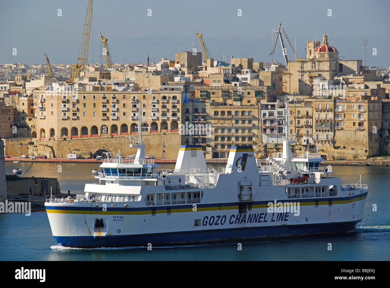 MALTA. The Malta to Gozo car ferry in the Grand Harbour, with Senglea