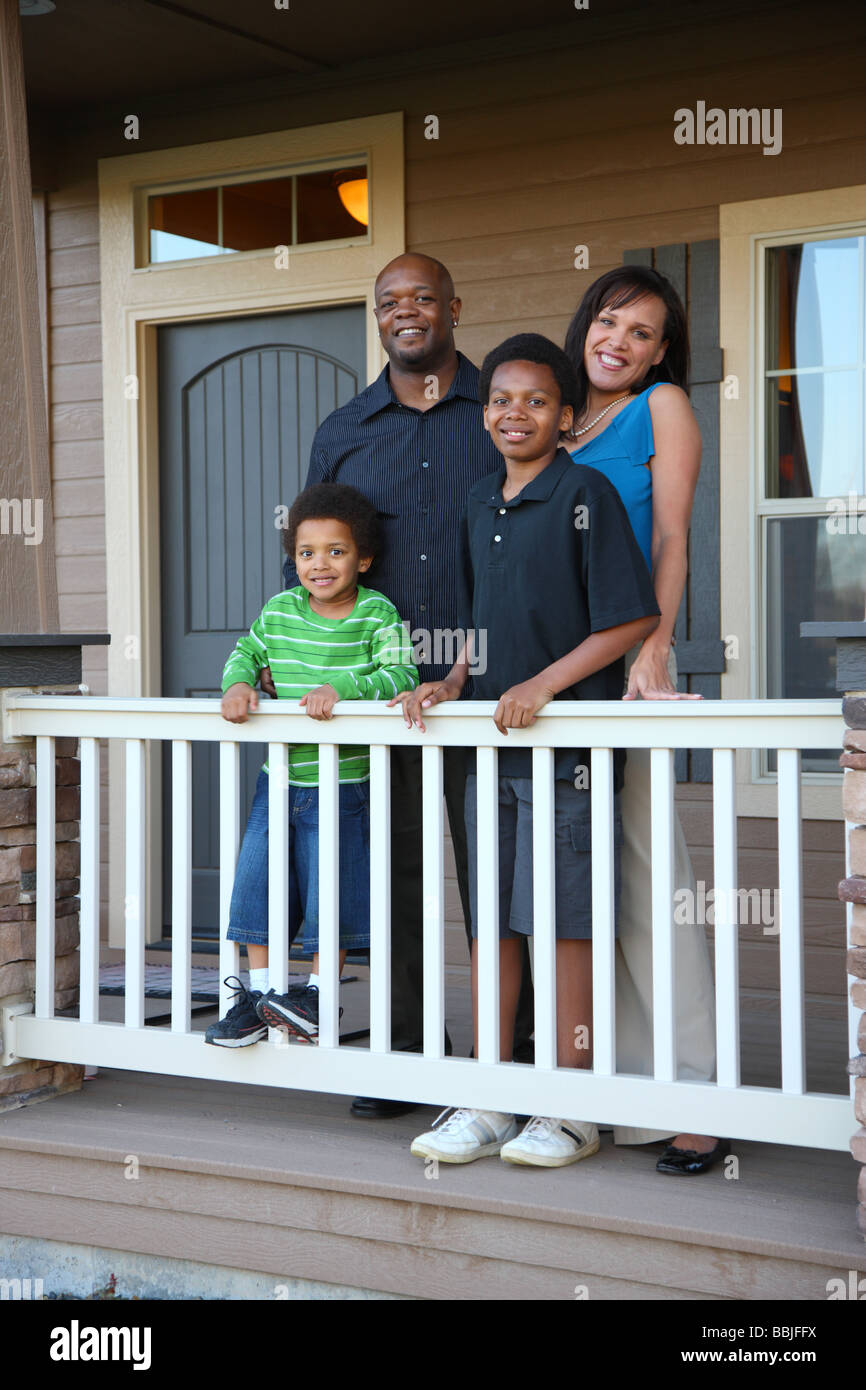 African American family on porch Stock Photo