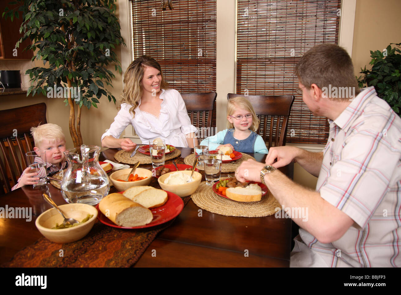 Family having dinner together Stock Photo