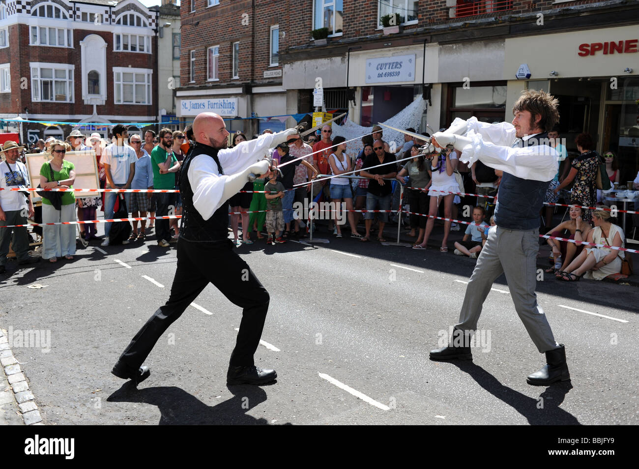 Sword fighting demonstration at the Sunflower Street Party in Kemp town Brighton UK Stock Photo