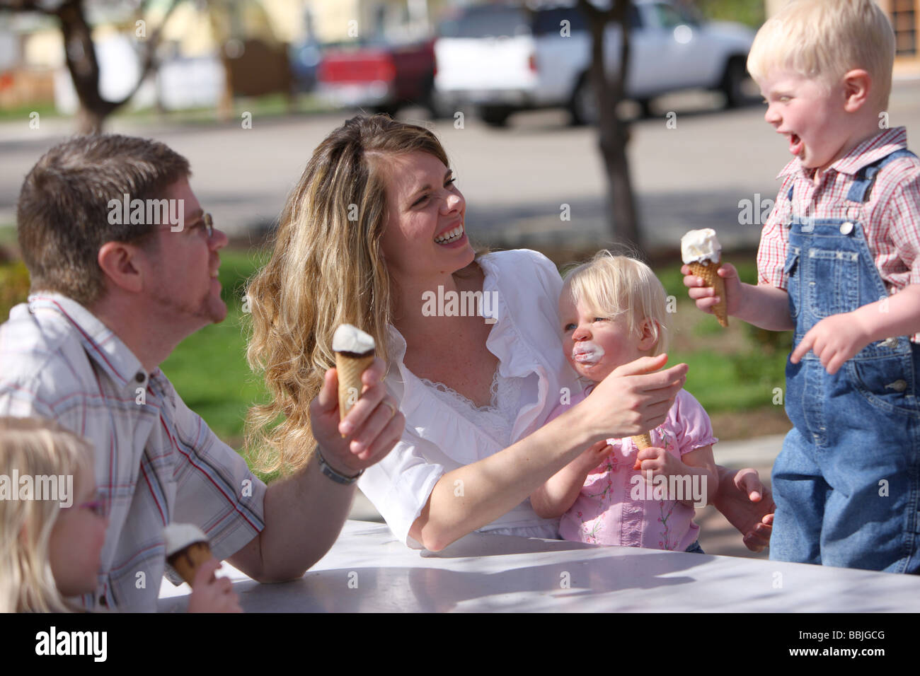 Family having ice cream cones together at park Stock Photo