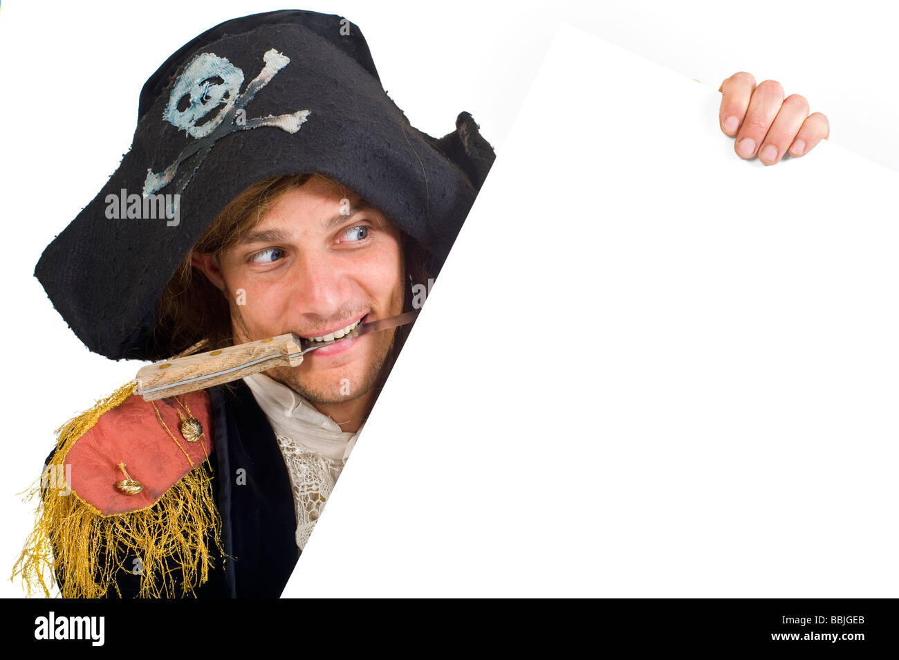 pirate holding a blank sign with knife in mouth Stock Photo Alamy